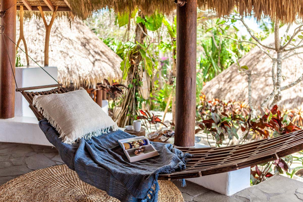 Relax in the hammock at Club House Bungalow